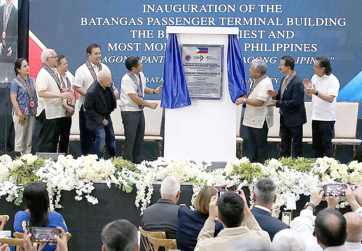 NEW PORT President Ferdinand Marcos Jr. leads the unveiling of the marker for the new passenger terminal building (PTB) at the Port of Batangas on Friday, April 26, 2024. With the President were officials from the local and national levels: the Department of Transportation, Dubai Ports World, Asian Terminals Inc., and the Philippine Ports Authority. PHOTO BY RENE H. DILAN