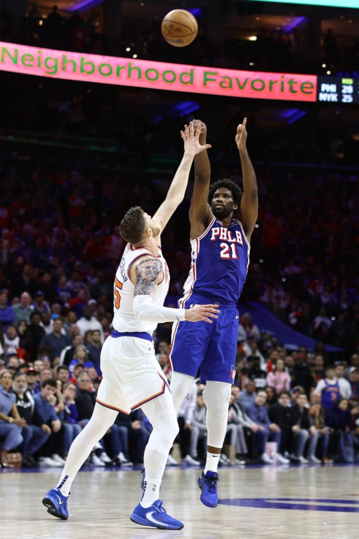RED HOT Joel Embiid (21) of the Philadelphia 76ers shoots over Isaiah Hartenstein of the New York Knicks during the third quarter of game three of the Eastern Conference First Round Playoffs at the Wells Fargo Center on Thursday, April 25, 2024, in Philadelphia, Pennsylvania. PHOTO BY TIM NWACHUKWU/AFP